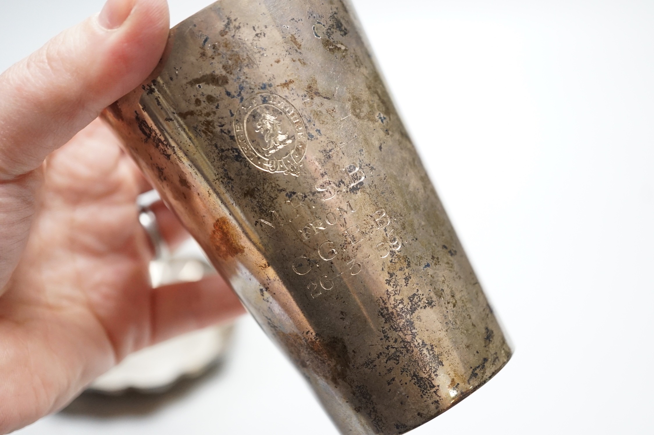 A late Victorian silver beaker, with later engraved inscription, London, 1898, 9.8cm and a 1970's silver small dish, 6.1oz.